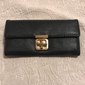 Black clutch with gold hardware